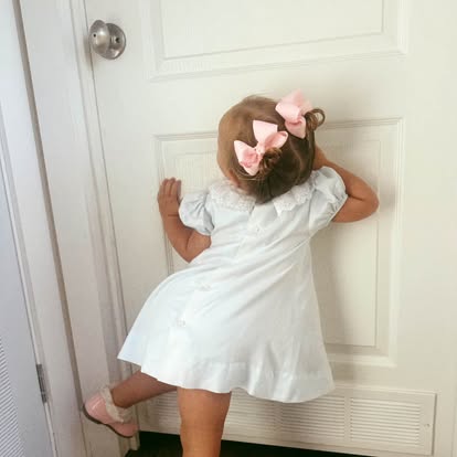 Young girl wearing vintage clothing from Dear Elliemae